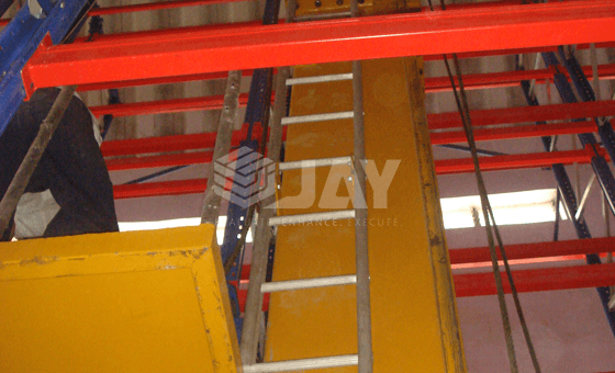 Warehouse storage system stacker cranes